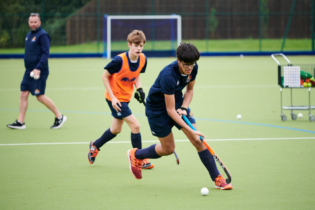 a picture of students playing hockey