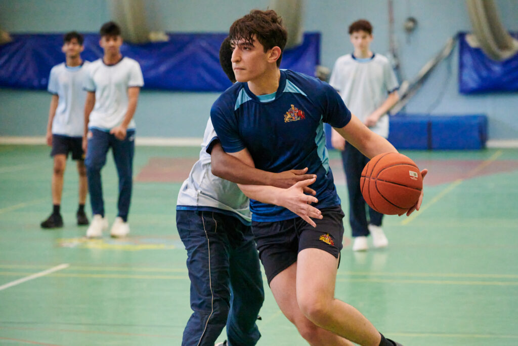 a picture of a group of students playing basketball