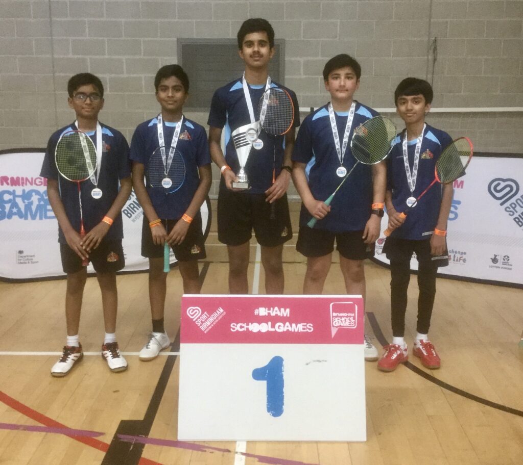 a picture of the badminton team at the championships
