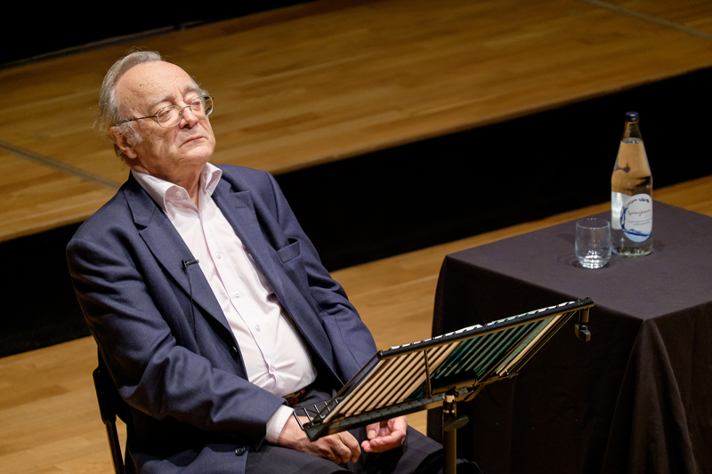 a picture of the world-class pianist giving the lecture