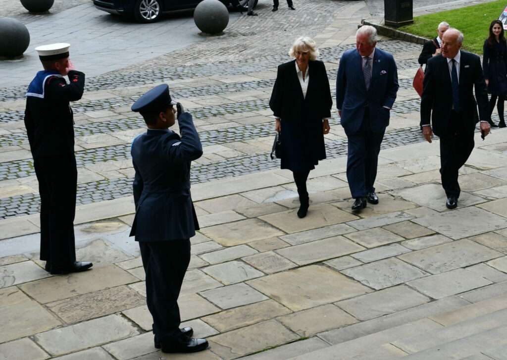Zain Aslam greeting The Prince of Wales and The Duchess of Cornwall