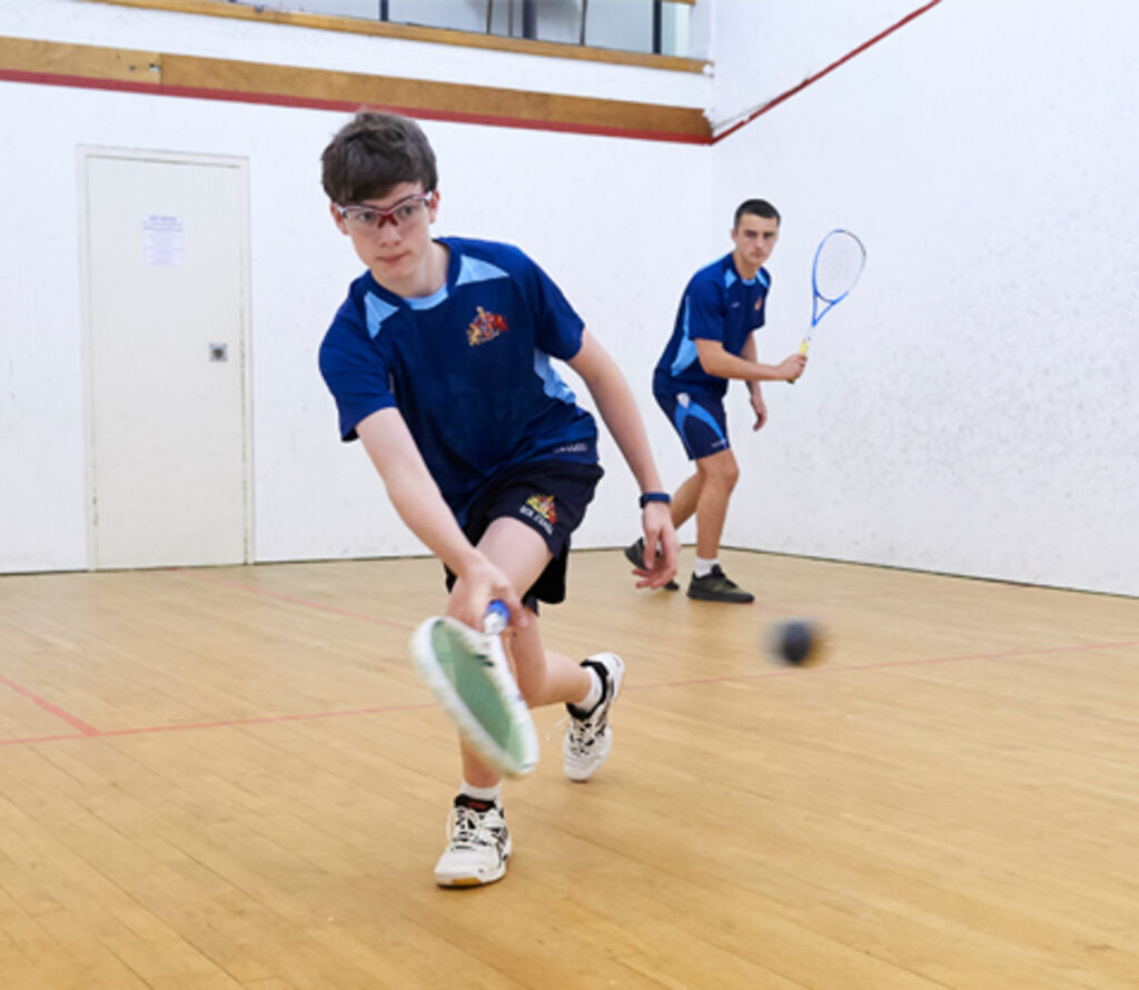 a picture of students playing squash