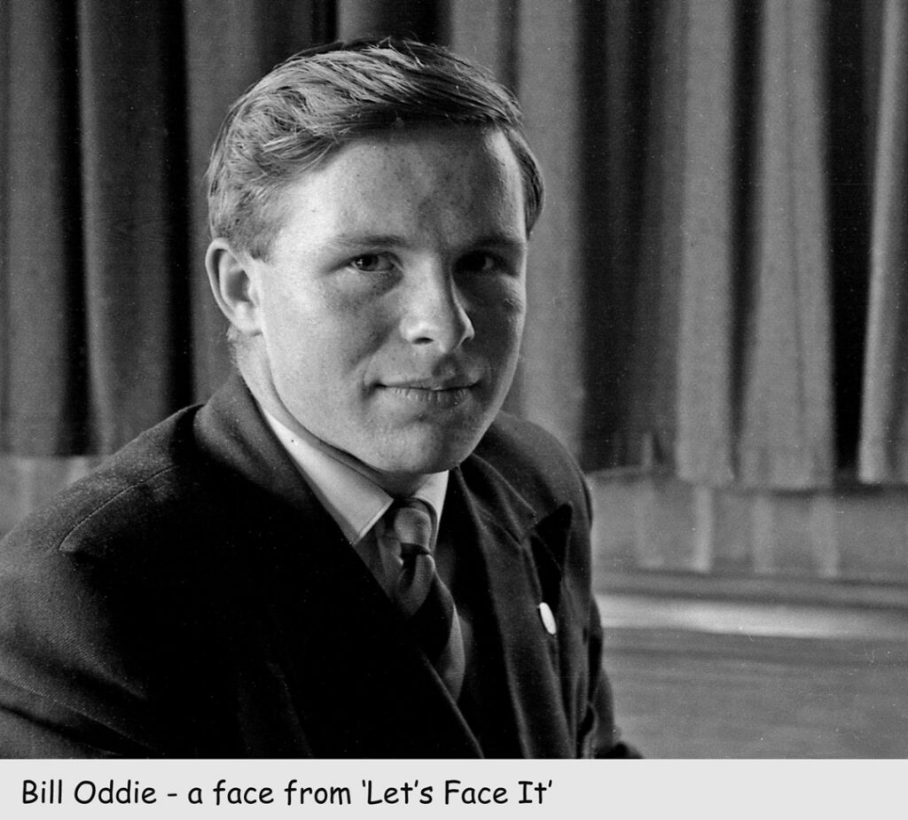 Portrait of Bill Oddie at KES, 1959. Seated wearing a blazer and tie, looking straight at the camera.